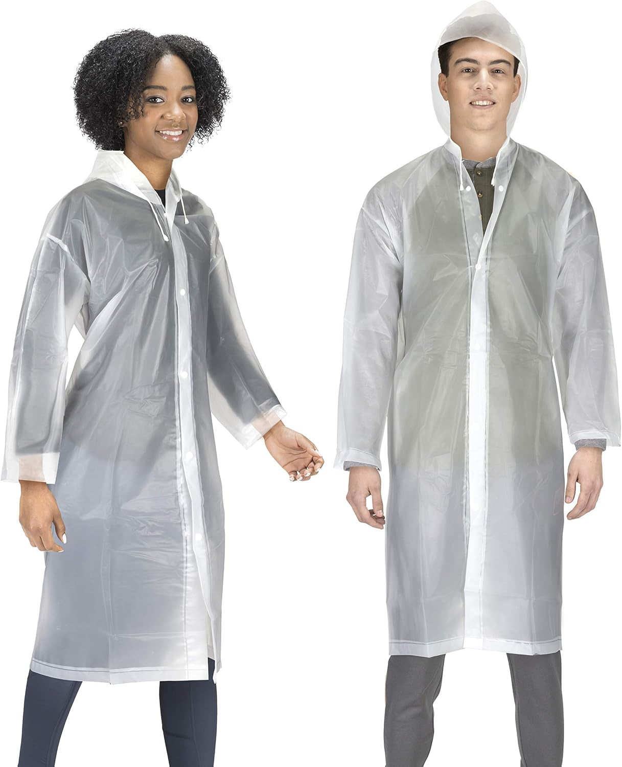 Family wearing matching rain ponchos at theme park attraction