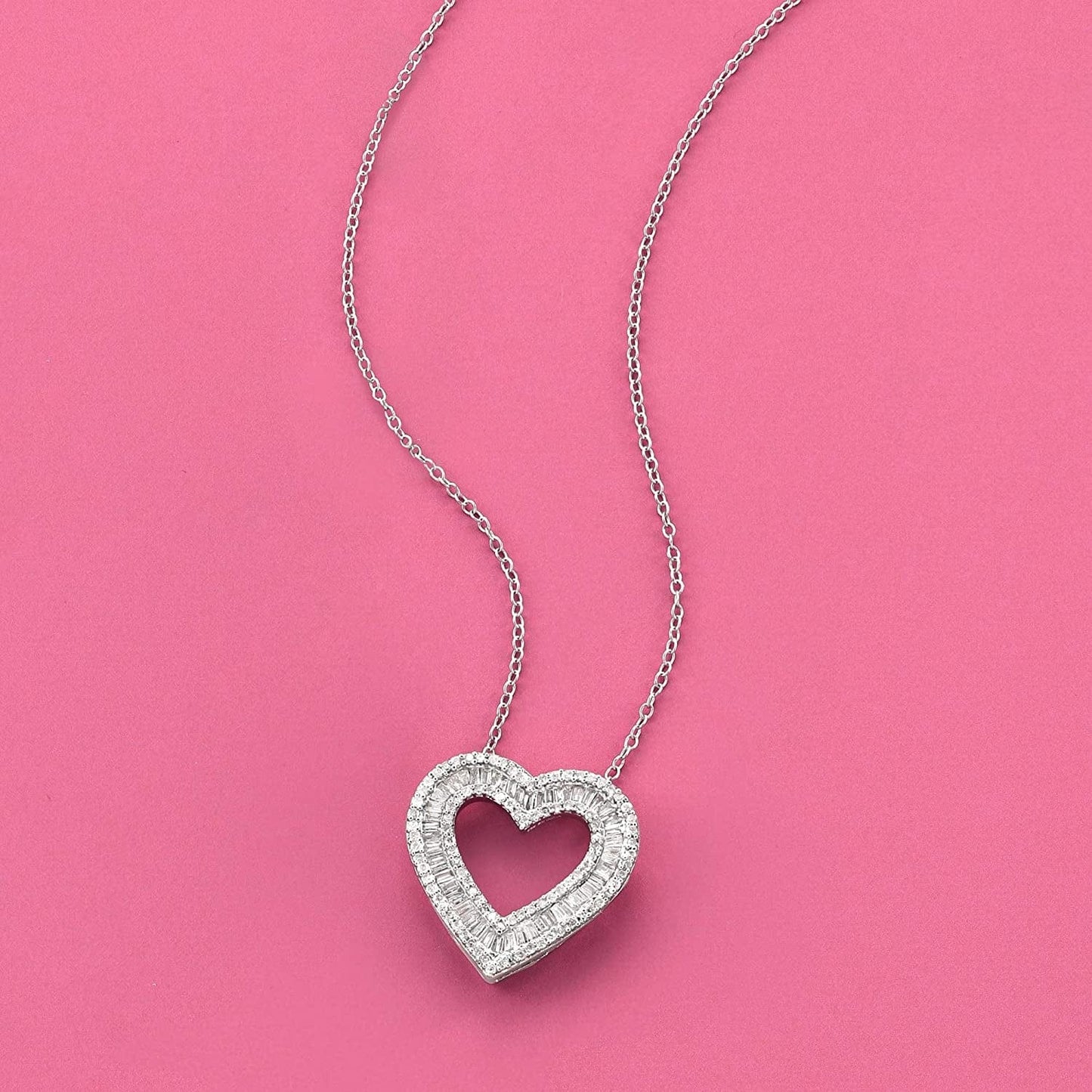 1.00 Ct. T.W. Baguette and round Diamond Heart Pendant Necklace in Sterling Silver