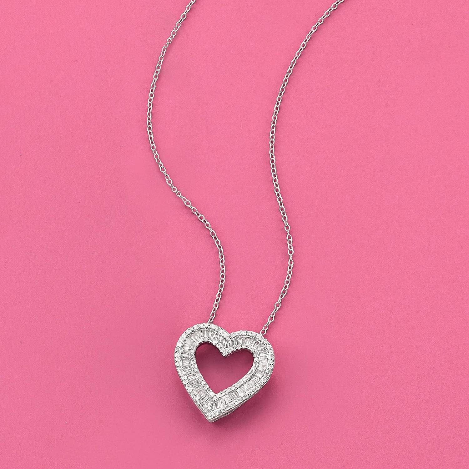 1.00 Ct. T.W. Baguette and round Diamond Heart Pendant Necklace in Sterling Silver