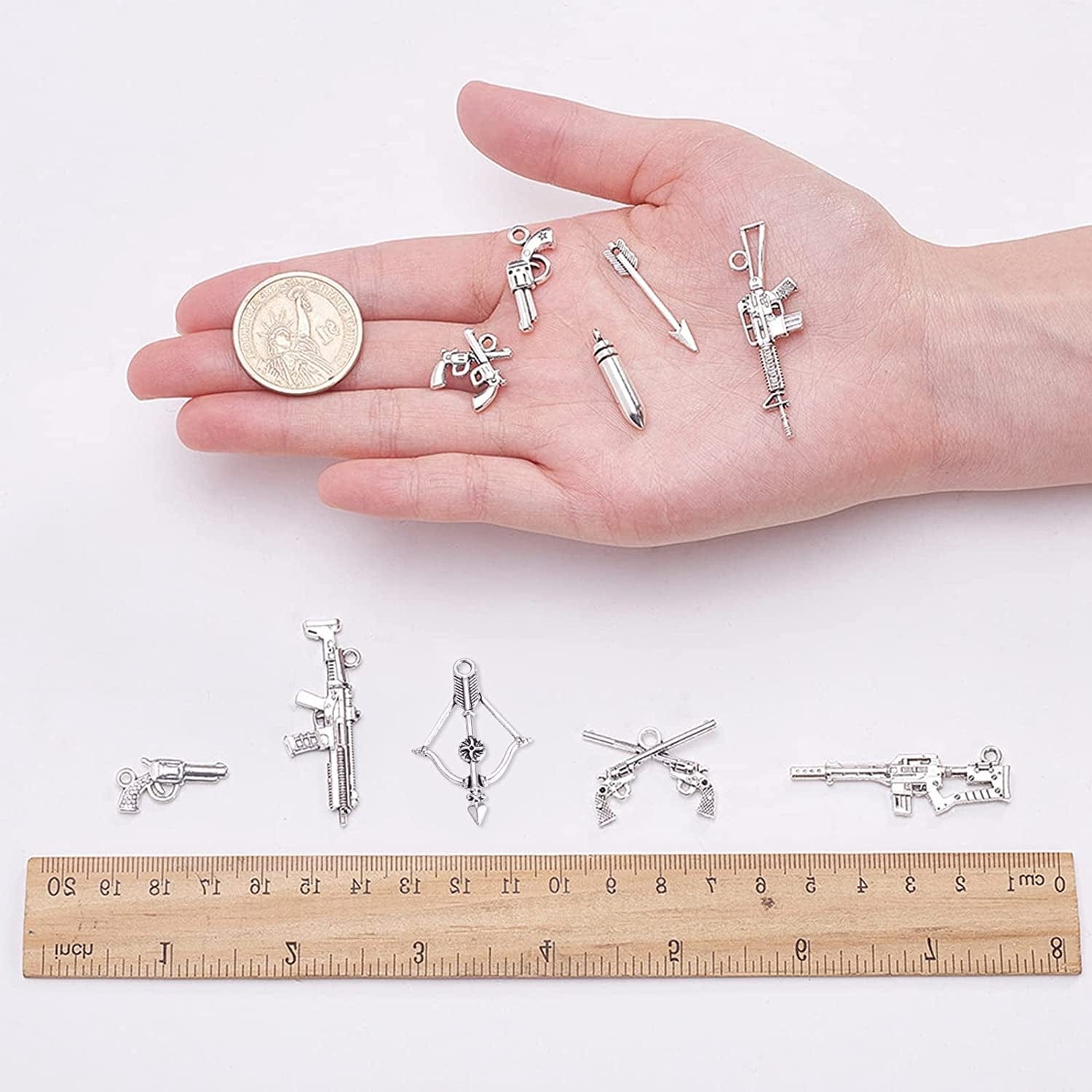 1 Box 40Pcs 10 Styles Gun Pistol Revolver Weapon Charms Pendants Craft Supplies Bow Arrow Charms Pendant for Jewelry Finding Making Accessory for DIY Bracelet