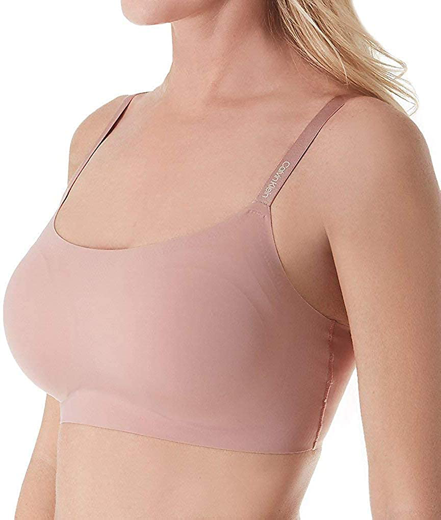 Calvin Klein Women's Invisibles Comfort Seamless Adjustable Skinny Strap Bralette Bra Apparel & Accessories > Clothing > Underwear & Socks > Bras Calvin Klein Alluring Blush X-Small
