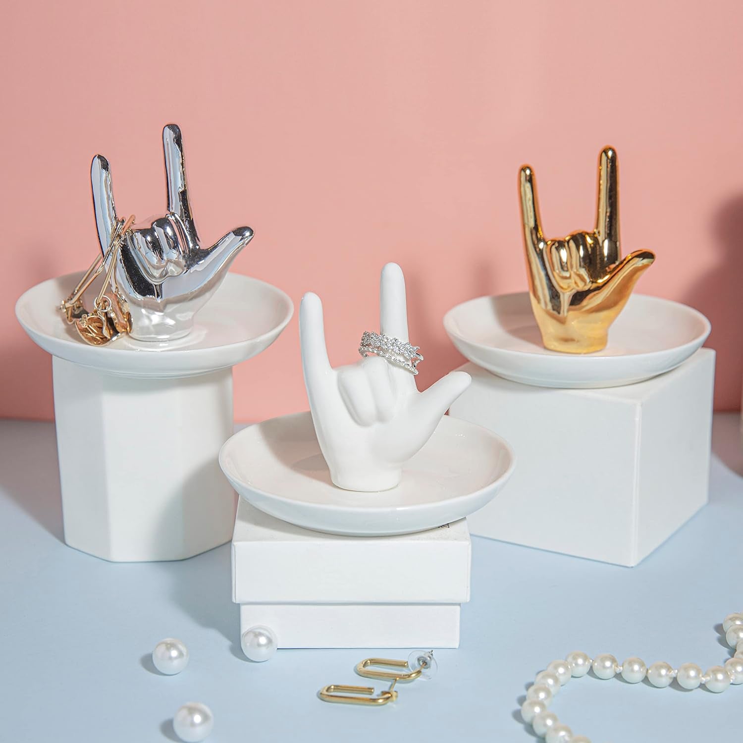 Ceramic jewelry organizer dish displaying organized rings and earrings