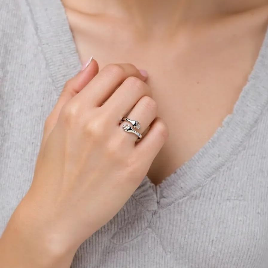 Close-up of no-tarnish copper granddaughter hug ring on finger