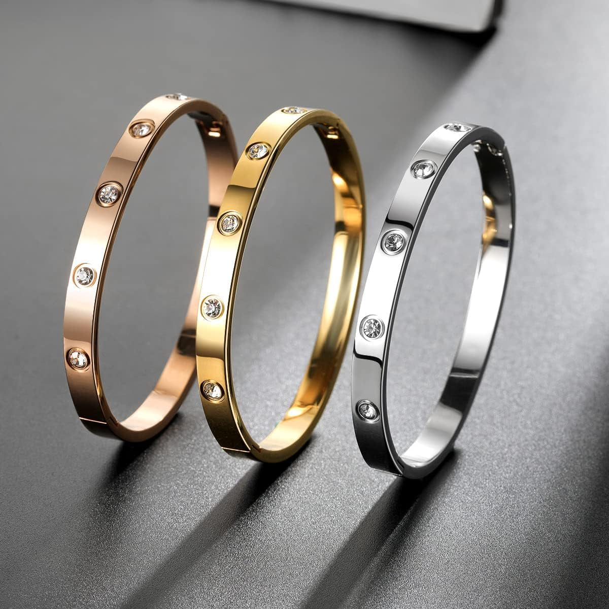 Gold-tone bangle bracelet set displayed on white background