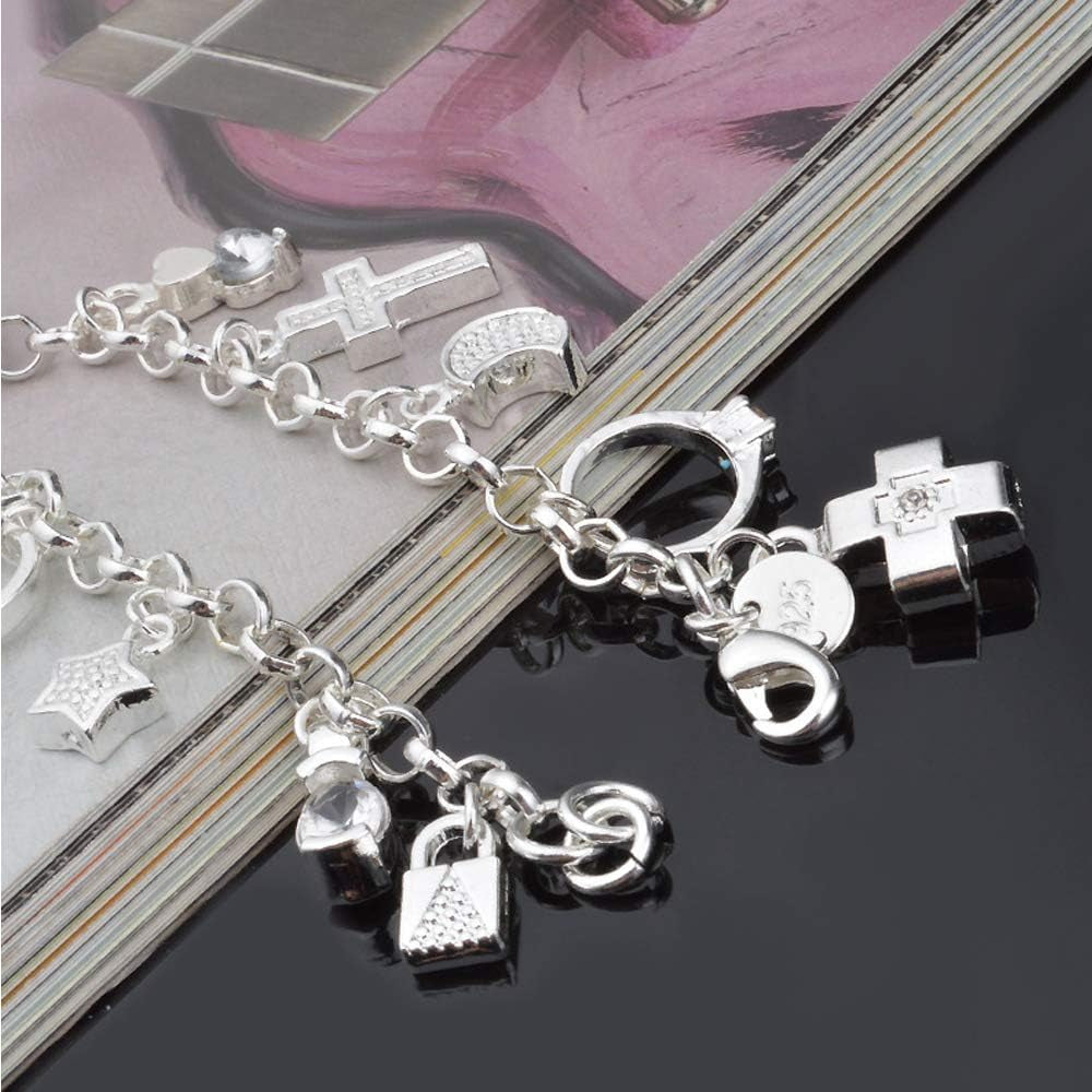 Silver charm bracelet worn on wrist displaying sparkling hanging pieces