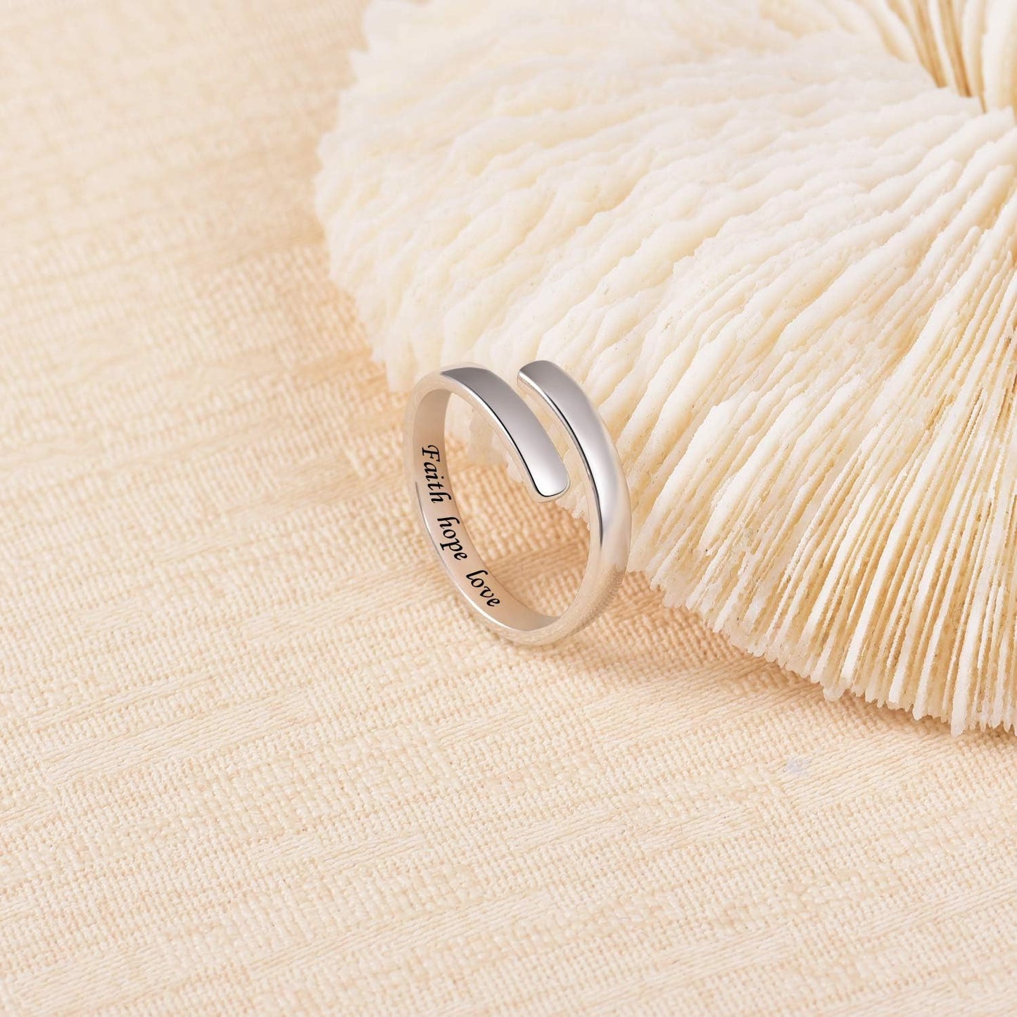 Sterling silver inspirational jewelry ring displayed on jewelry stand