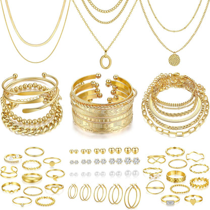 Gold bracelets and rings styled on woman's wrist and hand