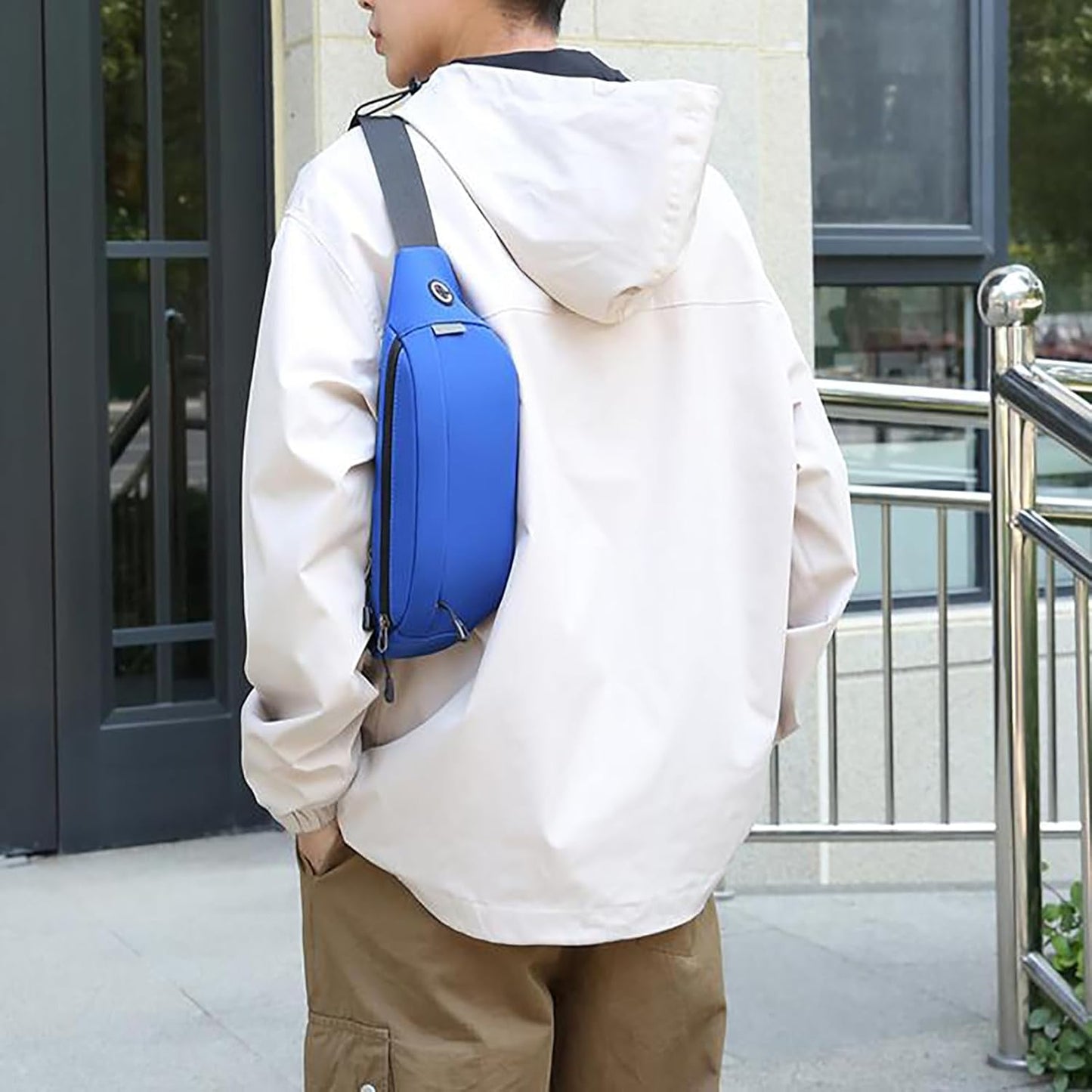 Crossbody waist bag showing 3 zipper pocket storage
