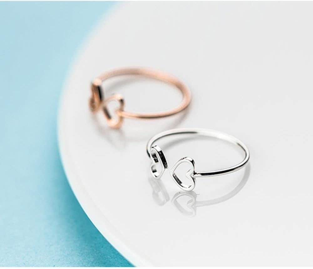Delicate double heart ring adjustable sizing demonstration