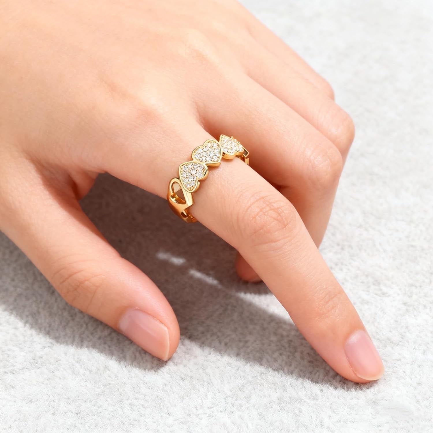 Adjustable women's gold promise heart ring on hand
