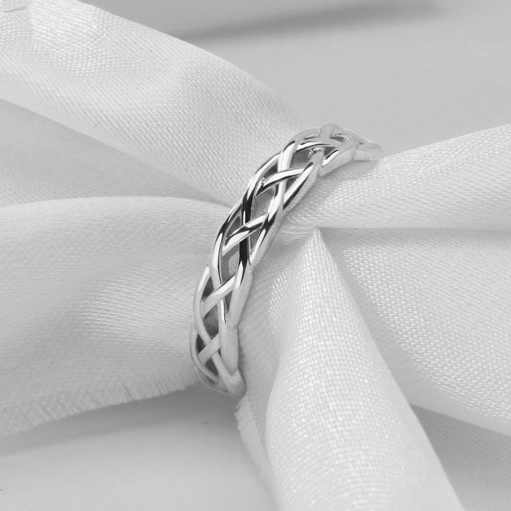 Rose gold Celtic knot stackable ring shown on model finger