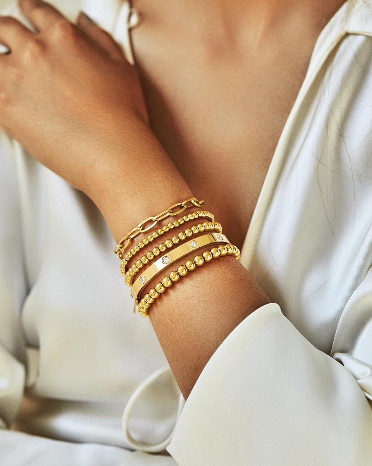 Love-inspired cubic zirconia gold bangle bracelet in detail view