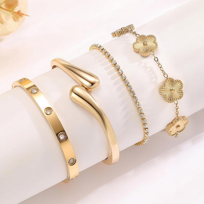 Woman wearing PDWZNBA gold plated stackable bracelets together
