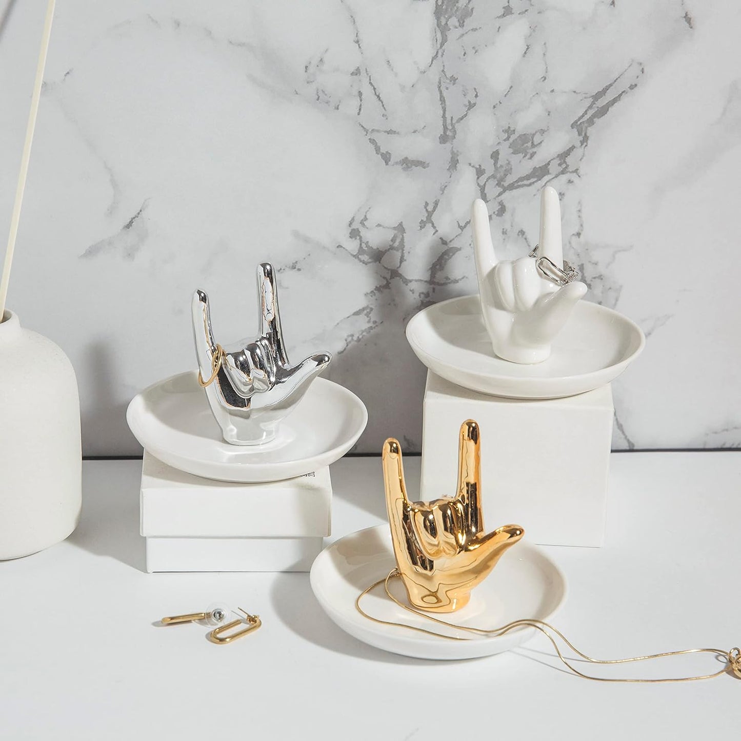 White ceramic hand ring holder styled as elegant room decor piece
