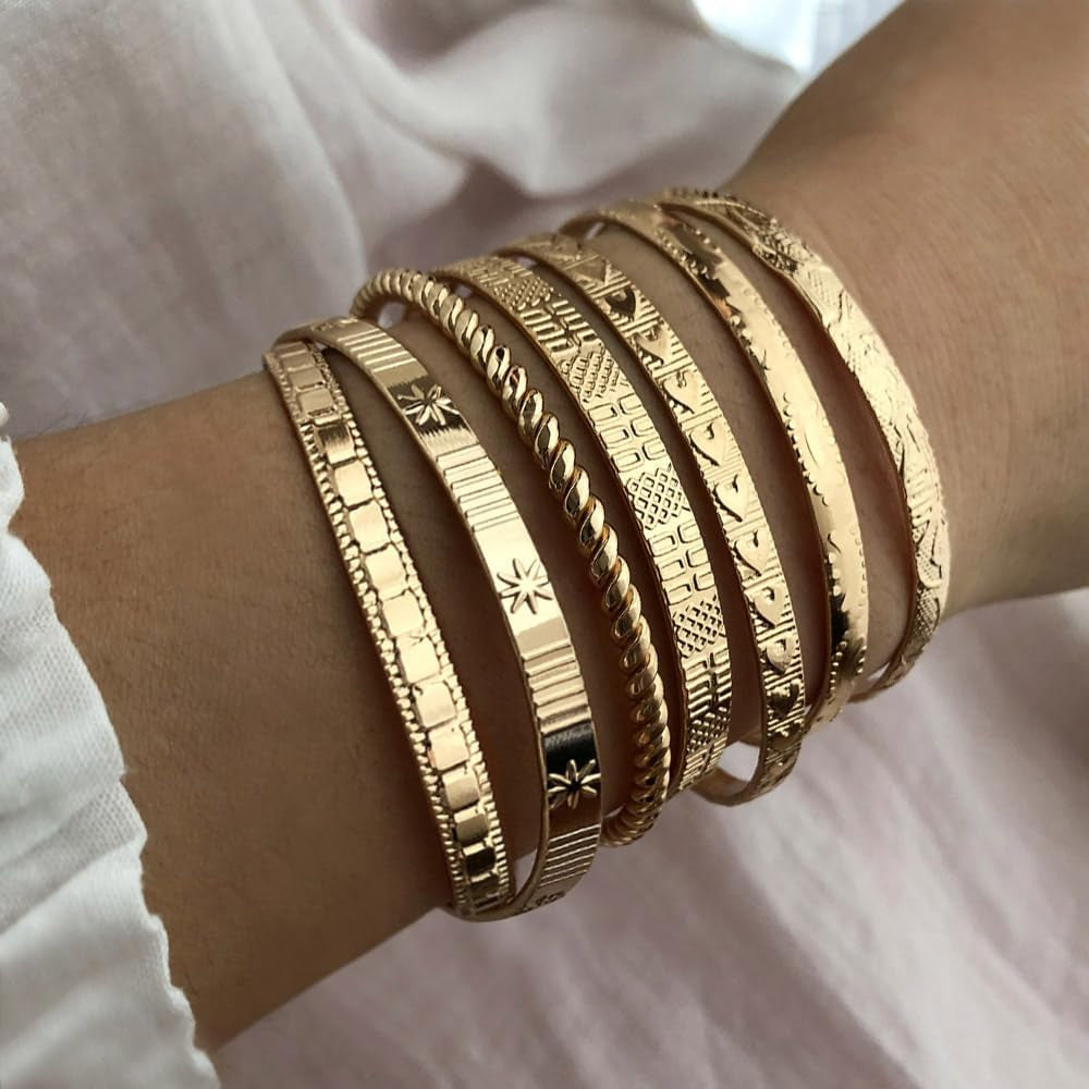 Gold-plated adjustable bangle bracelet showing intricate layering