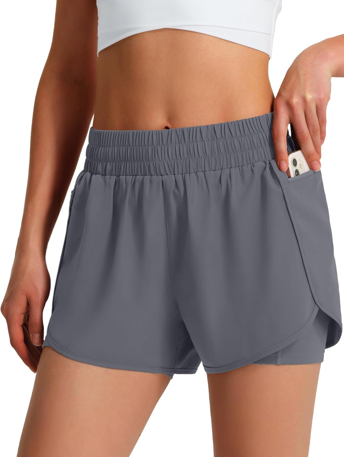 Fitness shorts for women showing dual phone pocket design