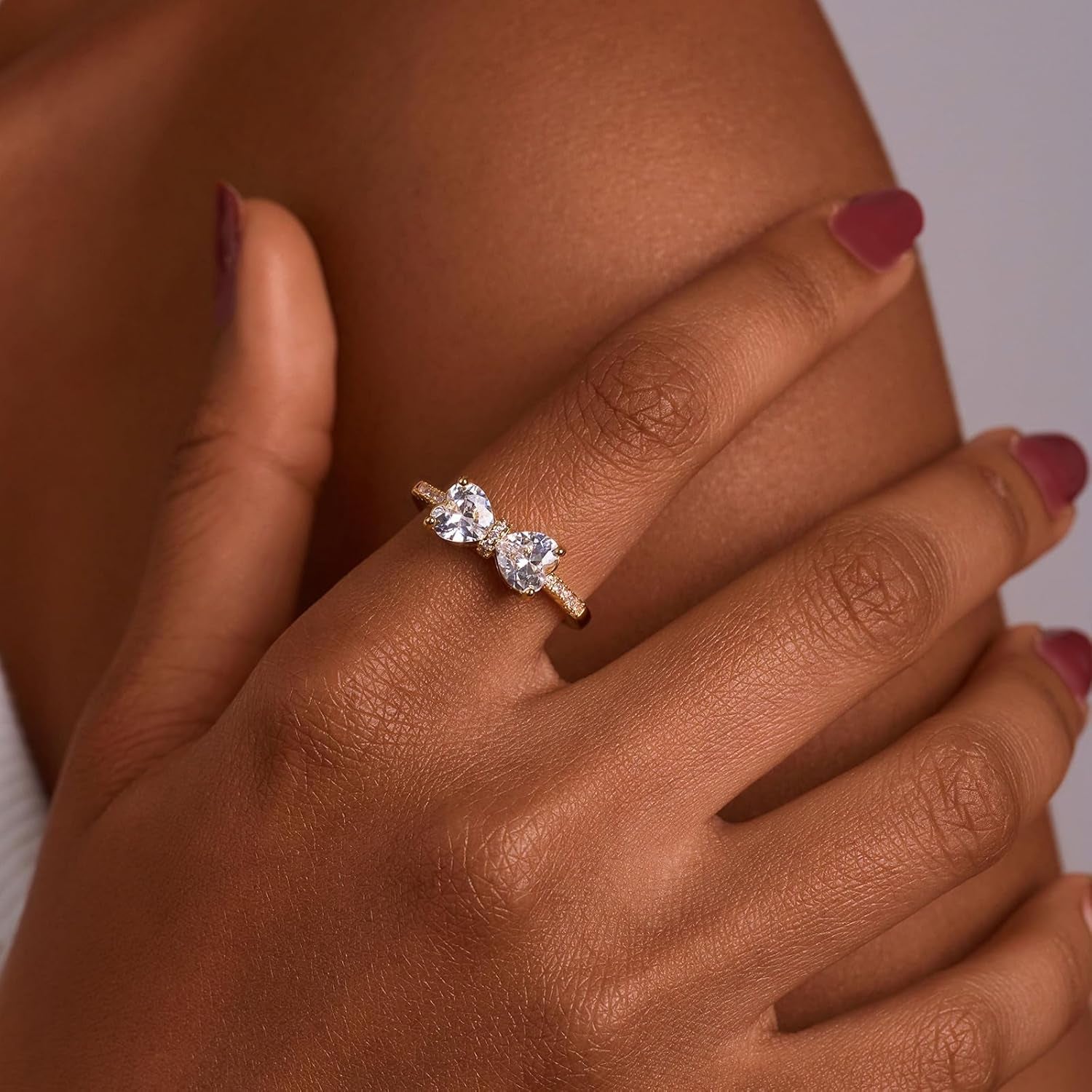 Double heart ring for women showing detailed butterfly gold plating