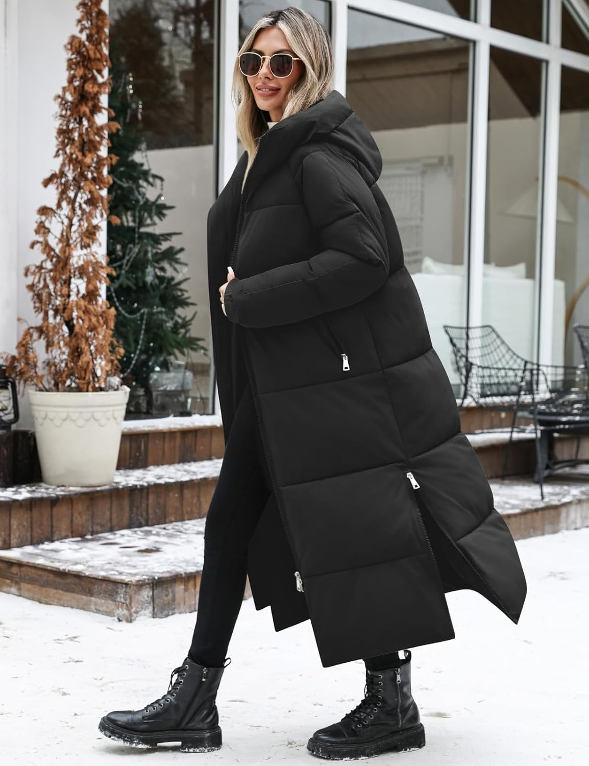 Women modeling black long quilted puffer coat in winter setting
