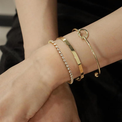 Close-up of 14K gold plated bangle bracelet showing non-tarnish finish