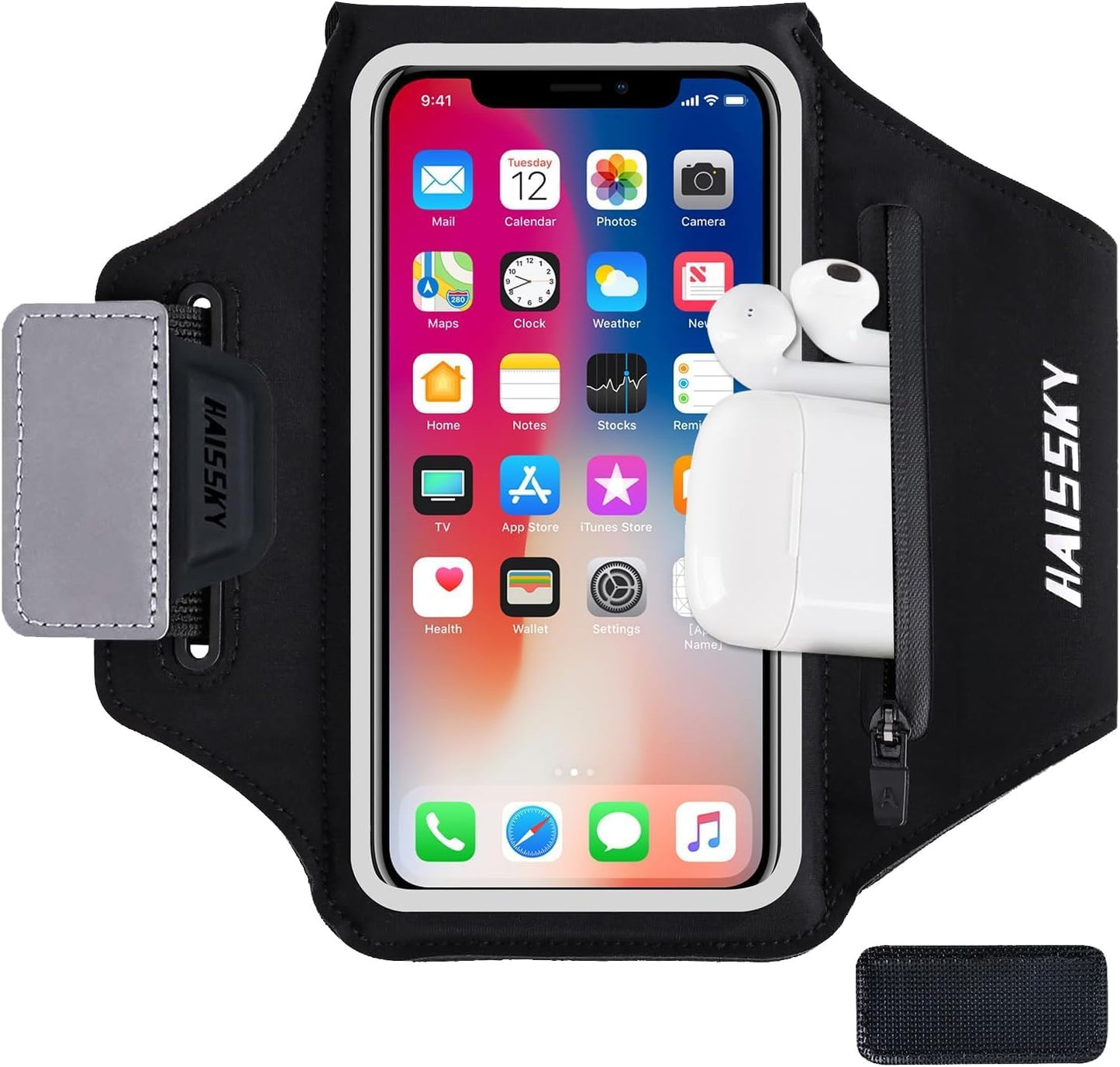 Woman wearing black running armband on arm during outdoor workout