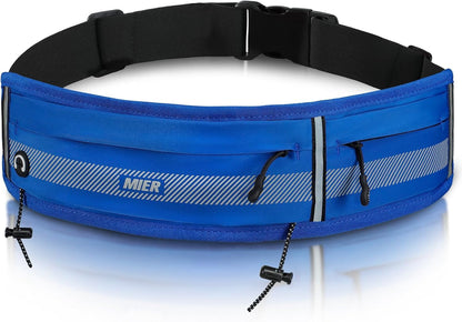 Woman wearing MIER running belt during marathon with race bib clip attached