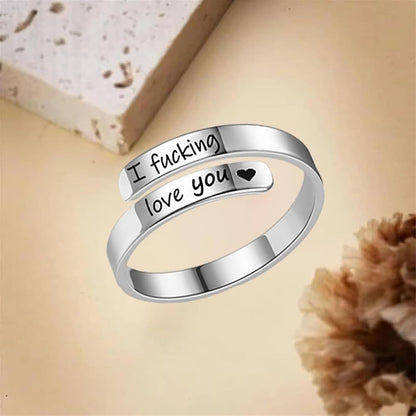 Stainless steel heart spiral wrap ring displayed in open adjustable form