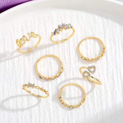 Trendy gold ring stack with moon and star charms