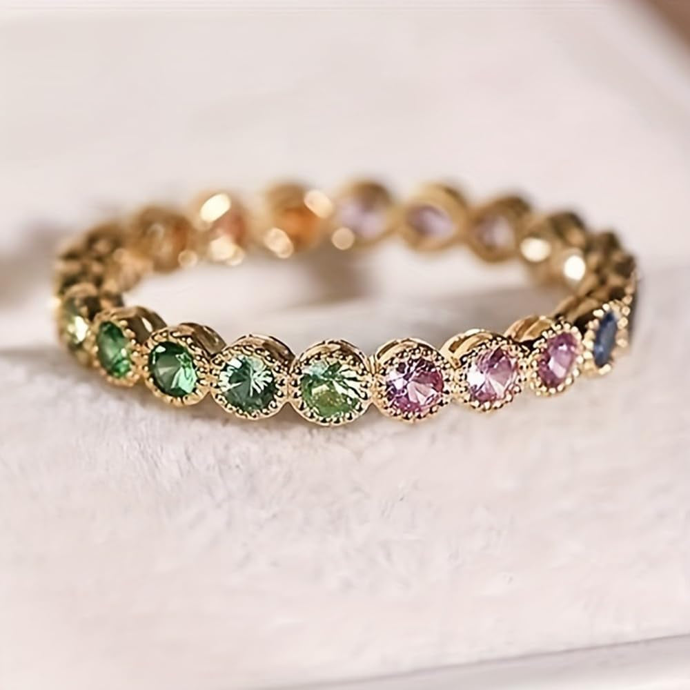 Gold plated cubic zirconia statement ring on woman's hand