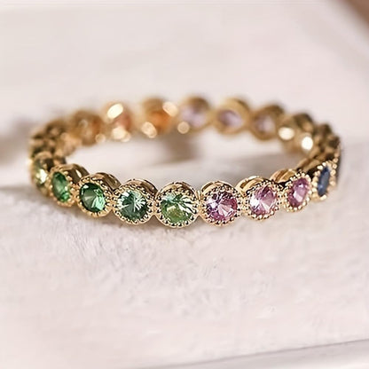 Gold plated cubic zirconia statement ring on woman's hand