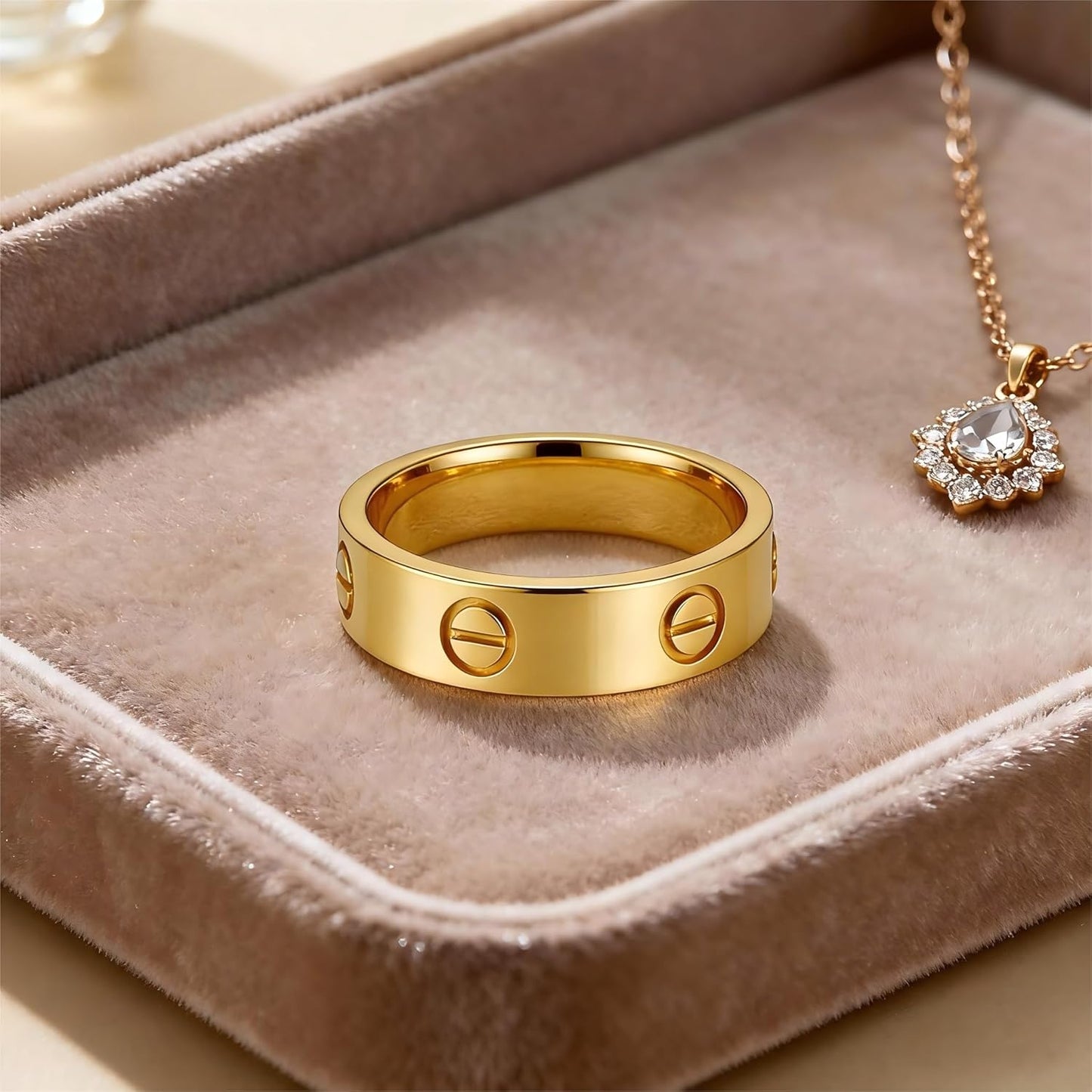Gold love ring on woman's hand displaying sophisticated style