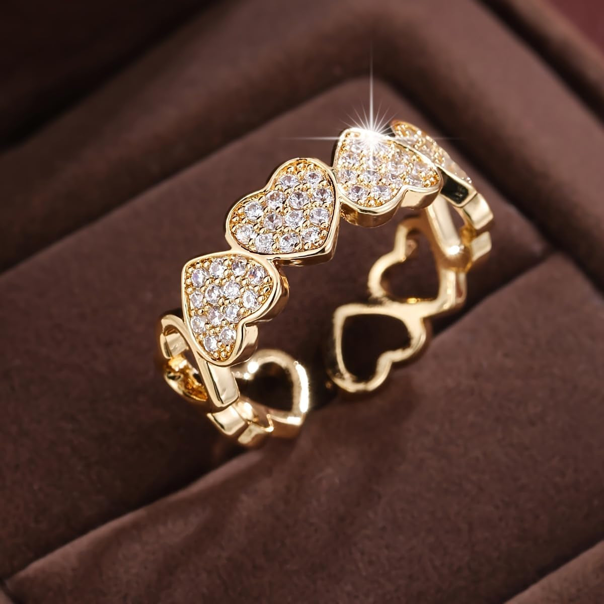 Women's adjustable gold heart promise ring showing sparkle