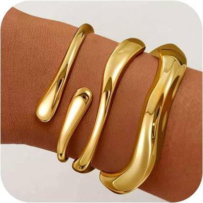 Multiple 18K gold plated bangle bracelets stacked together fashion
