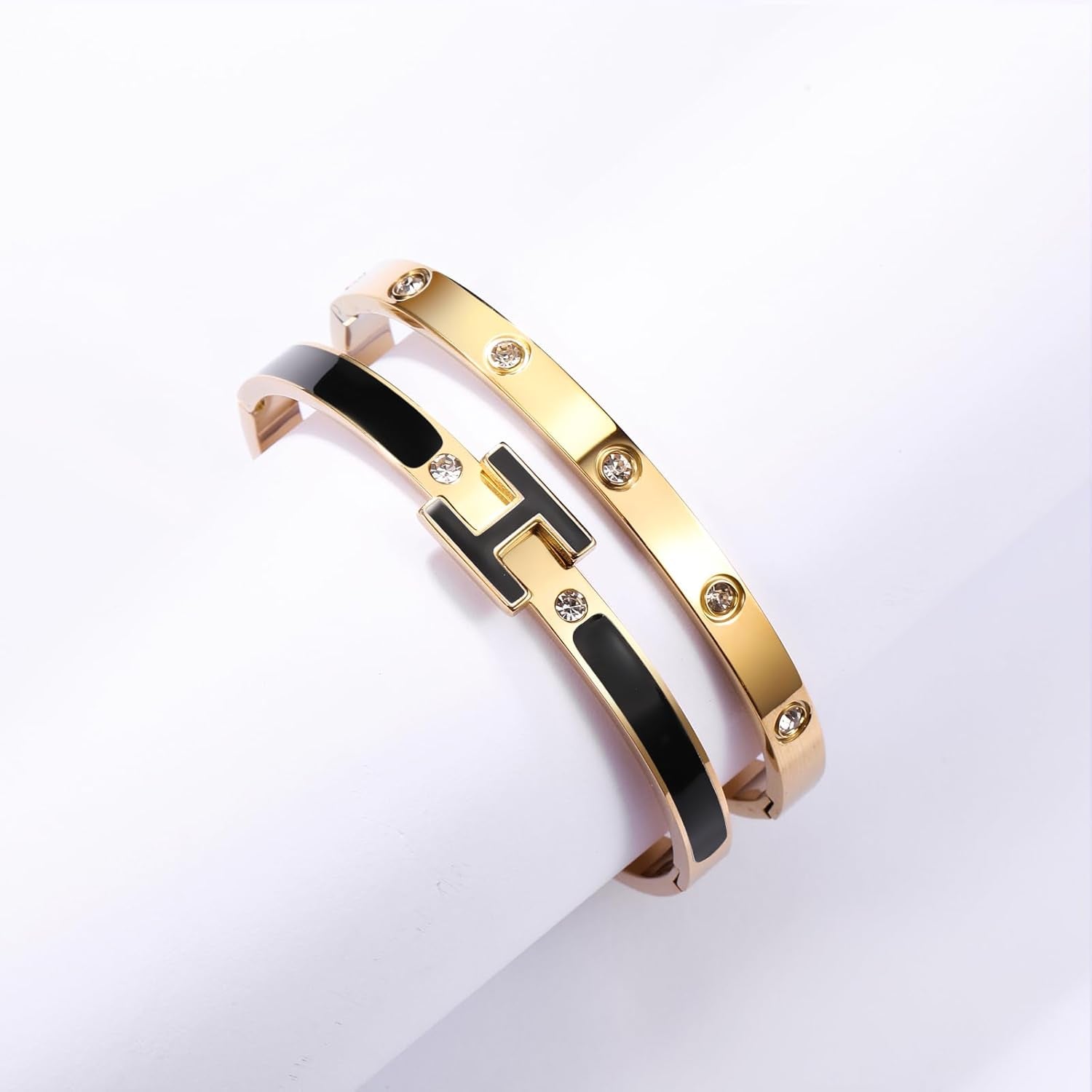 Stackable gold plated bracelets showing kindness love design