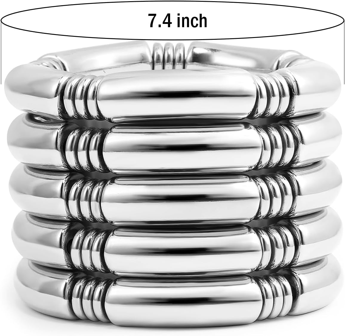 Stacked layered gold chunky bangle bracelets on woman's wrist