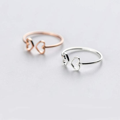 Minimalist double heart engagement ring in polished sterling silver