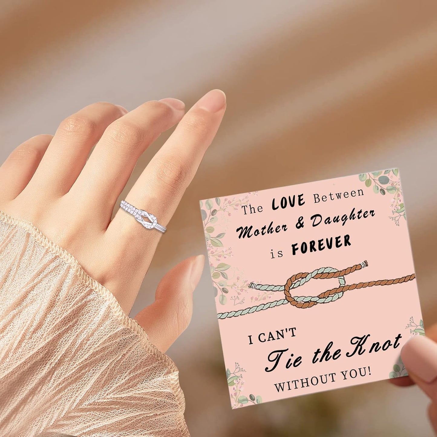 Sterling silver mother daughter ring on woman's hand