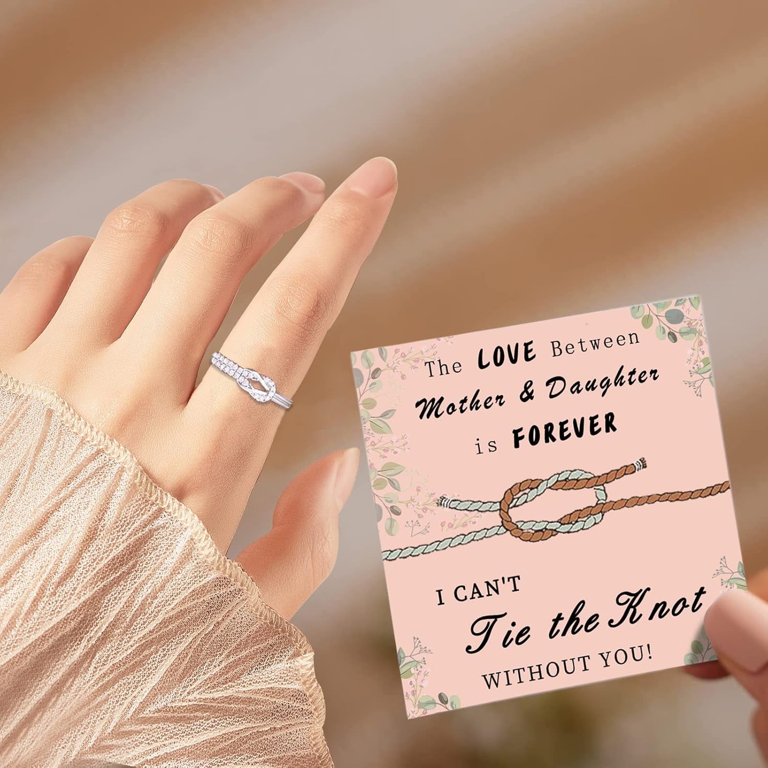 Sterling silver mother daughter ring on woman's hand