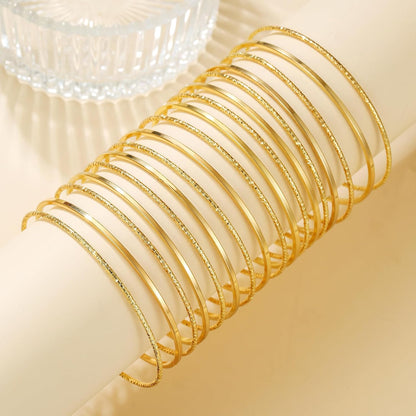 Stackable gold bangles bracelets for women layered look