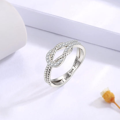 Close-up of intricate square knot pattern on ring