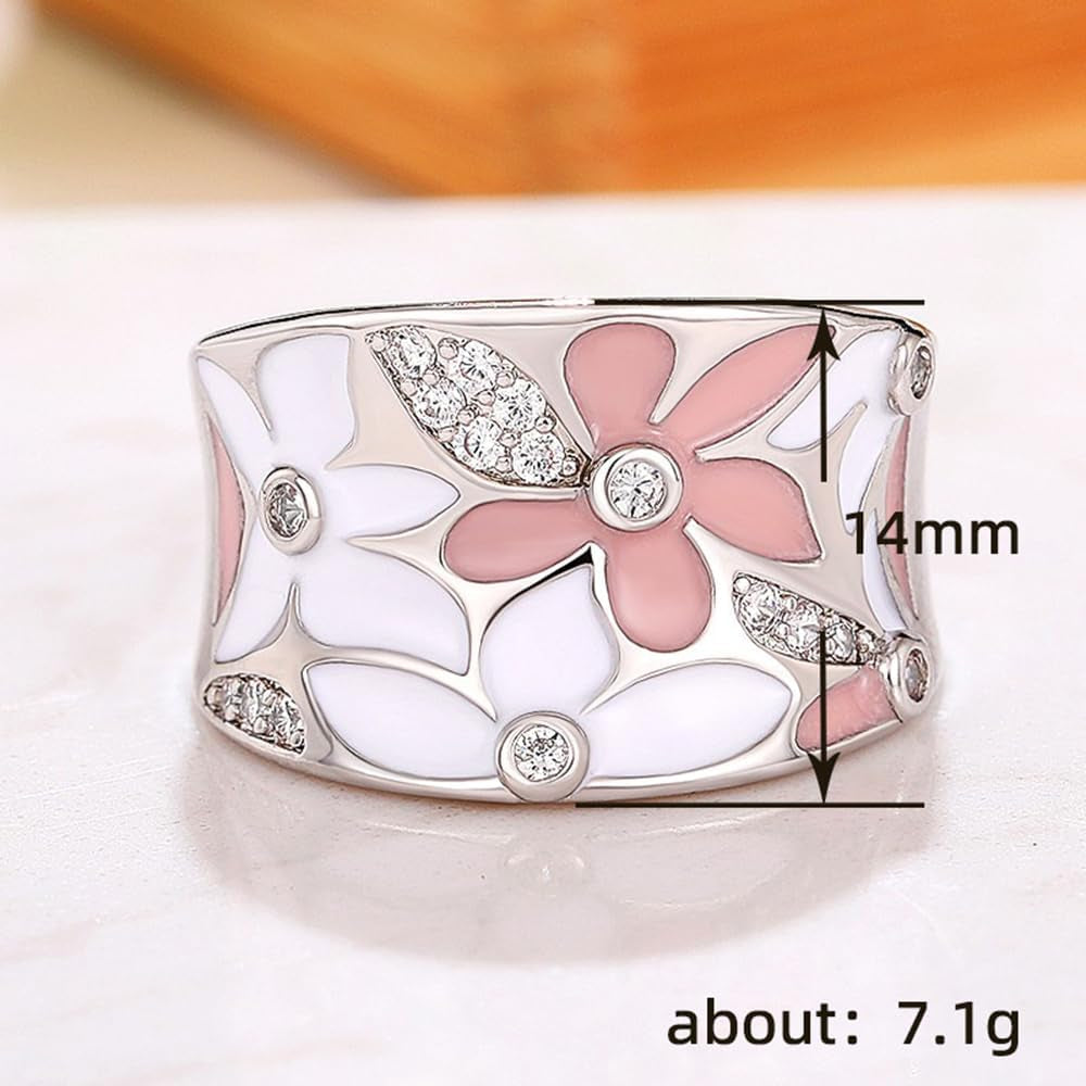 Woman wearing gold plated flower statement ring on hand