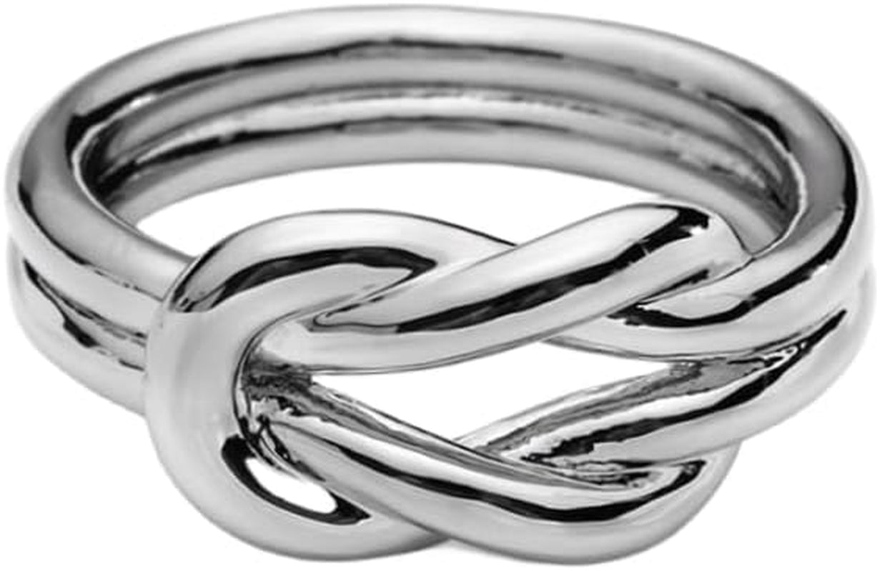 Layered knot silk scarf ring brooch on woman's finger