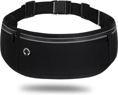 Black waterproof running belt fanny pack worn around woman's waist during outdoor jog