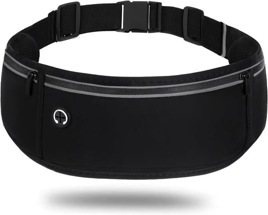 Black waterproof running belt fanny pack worn around woman's waist during outdoor jog