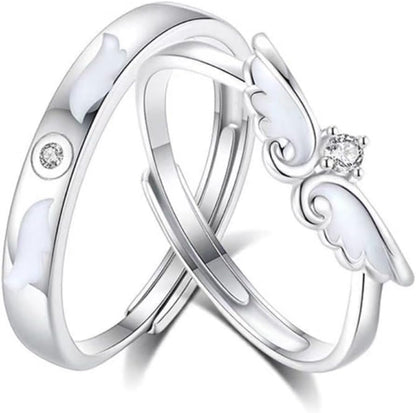 Couple holding hands wearing matching silver promise rings