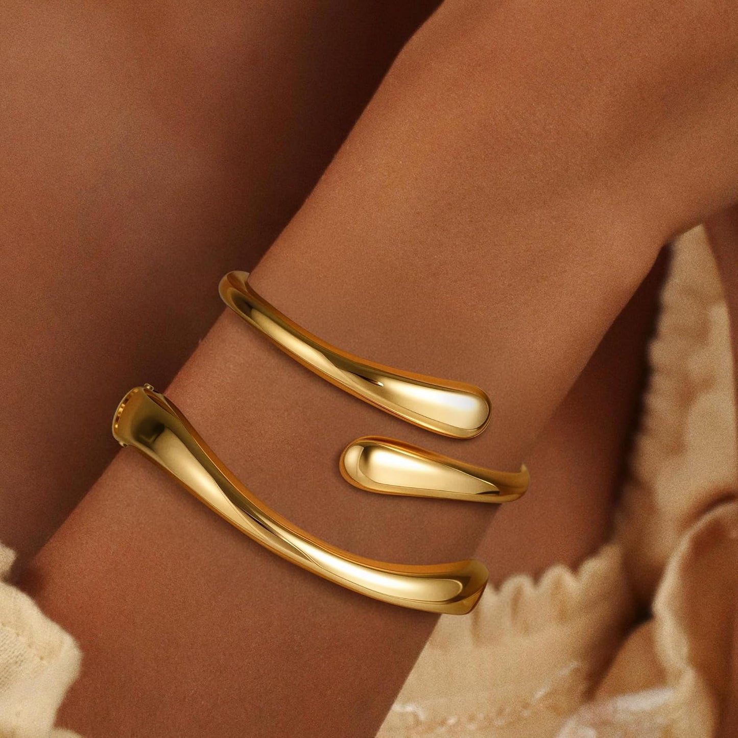 Woman wearing 18K gold plated non-tarnish bangle bracelet set