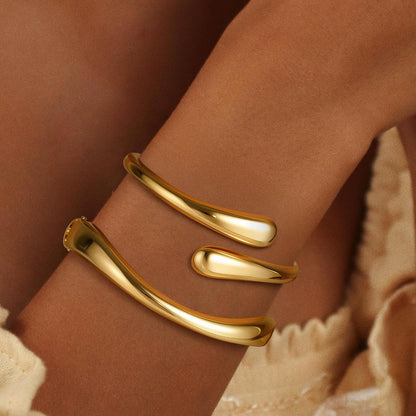 Woman wearing 18K gold plated non-tarnish bangle bracelet set
