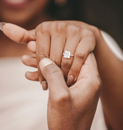 TIGRADE radiant engagement ring on hand sizing display