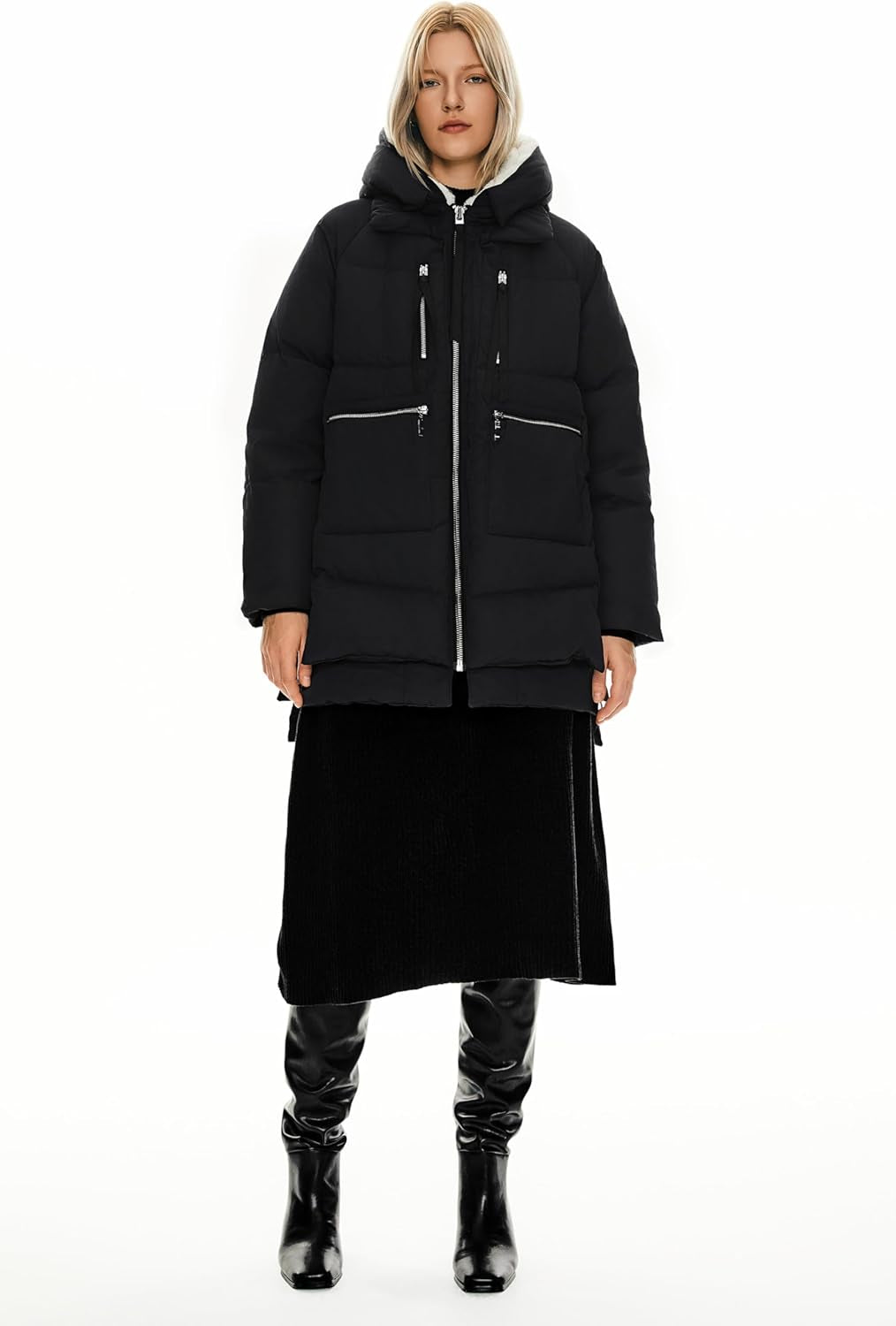 Woman wearing puffy down jacket in snowy winter conditions