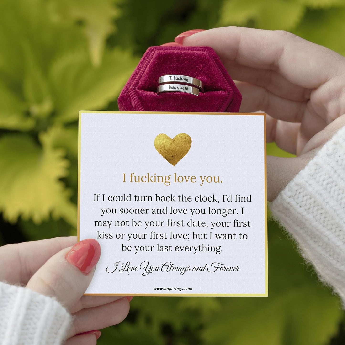 Close-up of stainless steel promise ring with engraved heart detail