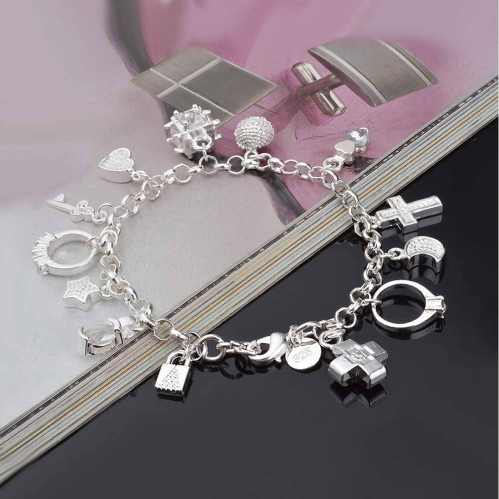 Close-up of sterling silver charm details including heart, star, and cross symbols